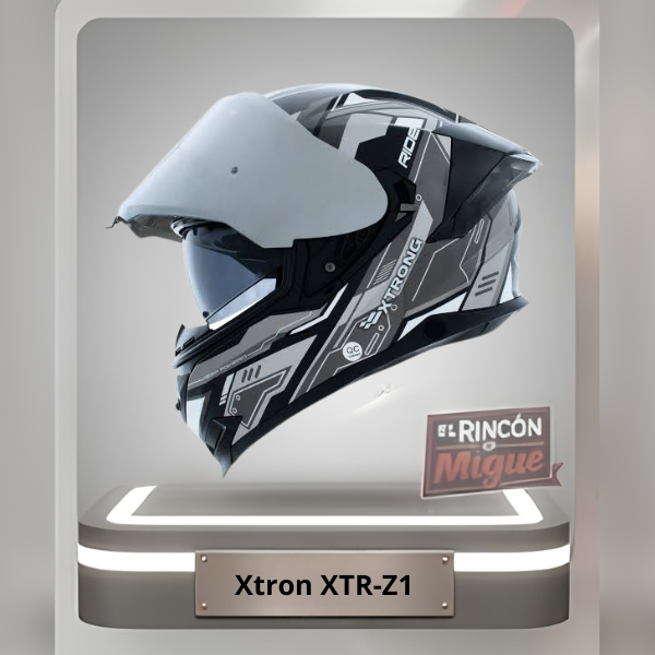 Casco de moto abatible Xtrong XTR-Z1 color blanco y negro con gráficos geométricos y visor transparente.
